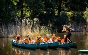 children kayaking at Cave Hill Creek