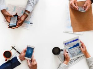 business people reading news online